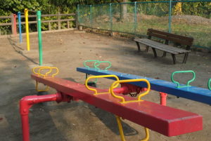 two empty seesaws on a playground